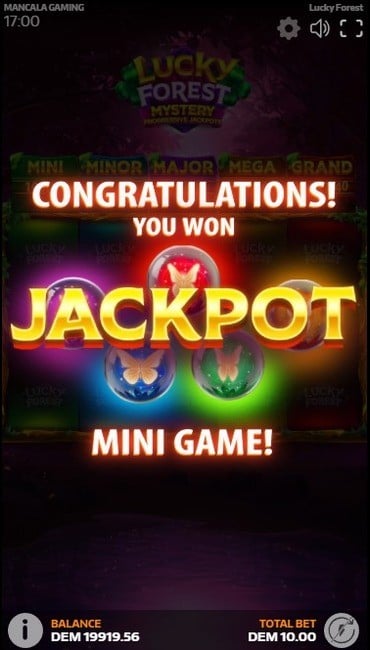 The Lucky Forest transition screen into the jackpot game. It congratulates the player and shows the five different color-coded butterflies that this minigame uses.