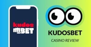 KudosBet Casino Review by Slotsoo.com. Slotsoos eyes are looking at KudosBet logo on a mobile phone screen.
